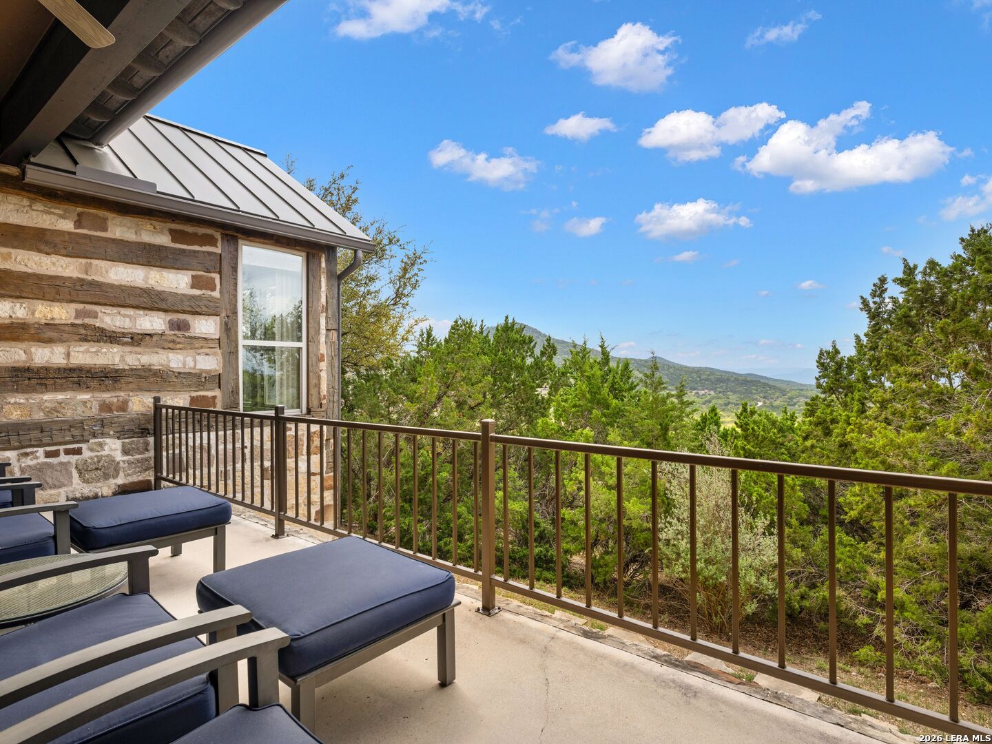 2601 B And R Road Utopia, TX 78884 - Photo 37 of 70 a view of a balcony with chair and wooden floor