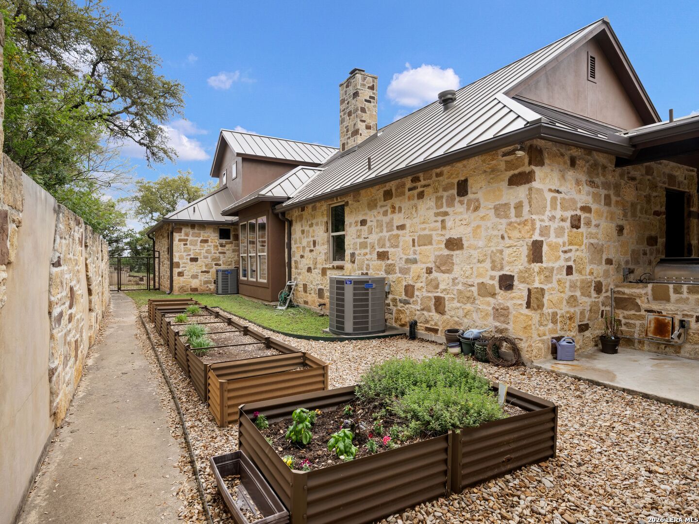 2601 B And R Road Utopia, TX 78884 - Photo 44 of 70 a front view of a house with garden