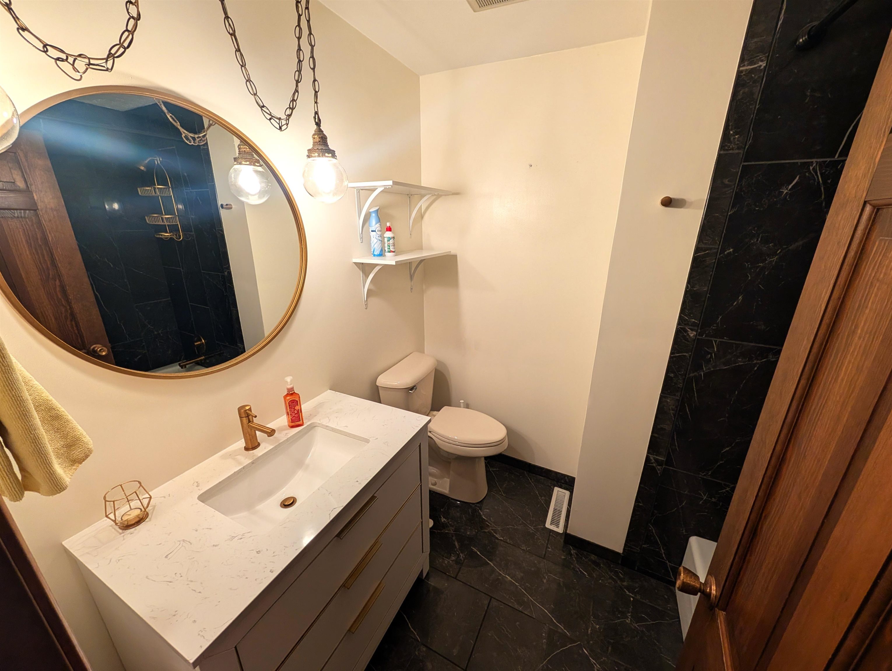 5293 Arbutus Road Rockford, IL 61107 - Photo 11 of 18 a bathroom with a sink and mirror