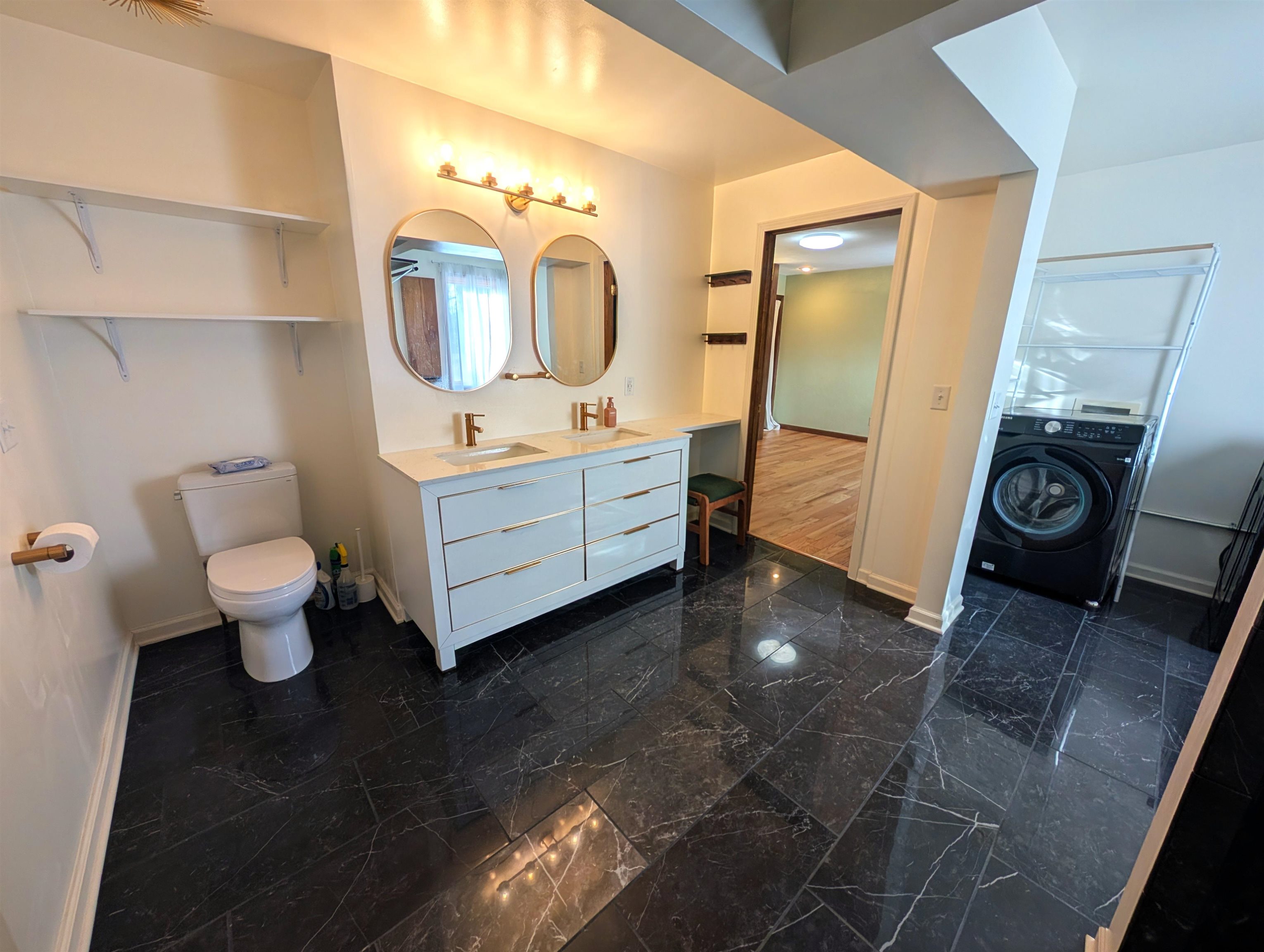 5293 Arbutus Road Rockford, IL 61107 - Photo 15 of 18 a bathroom with a toilet sink and mirror