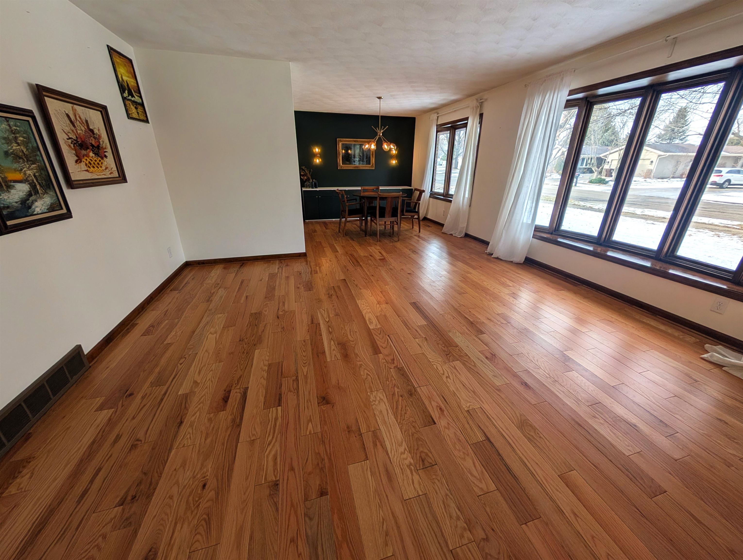5293 Arbutus Road Rockford, IL 61107 - Photo 2 of 18 wooden floor in an empty room with a window