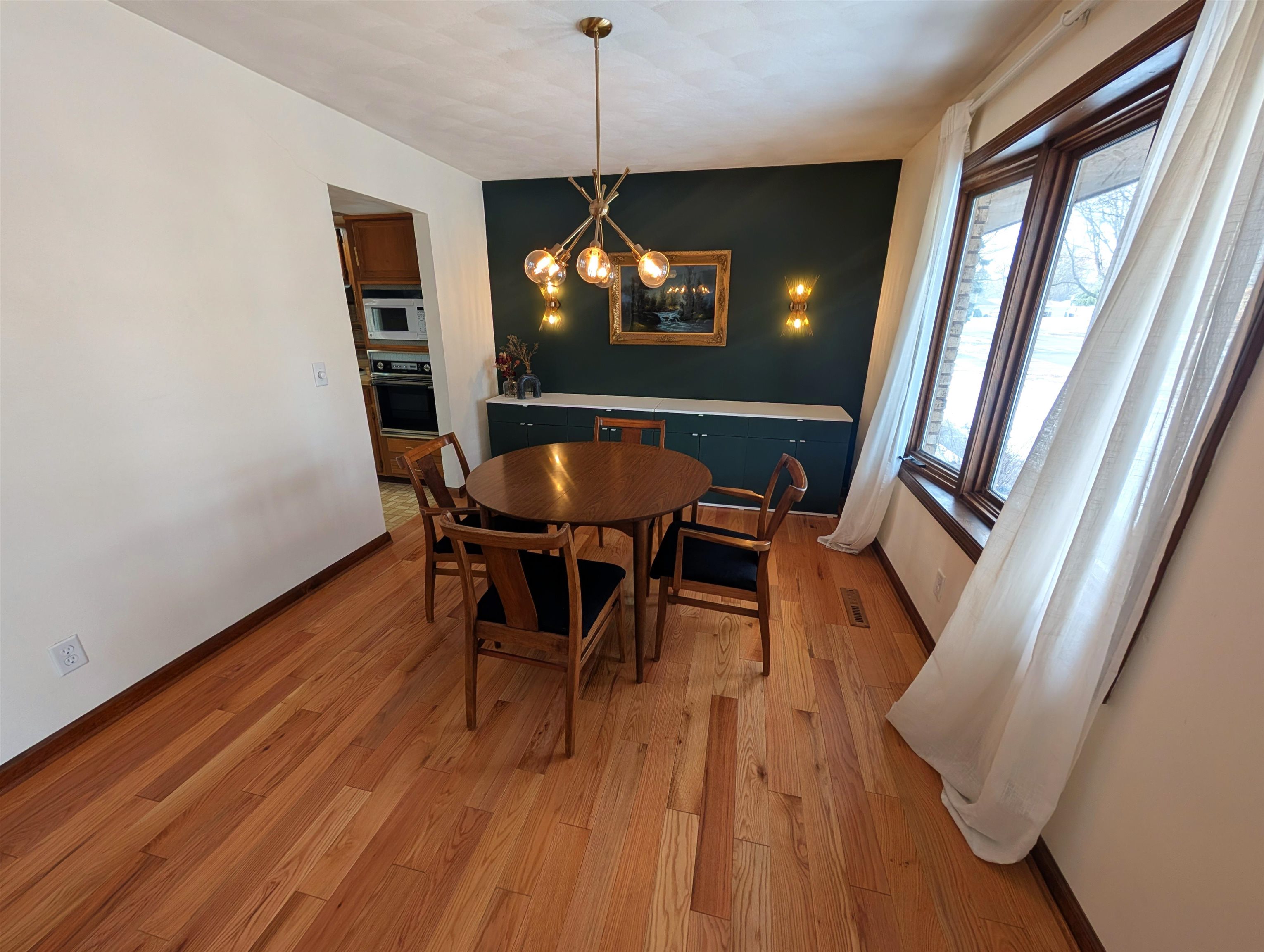 5293 Arbutus Road Rockford, IL 61107 - Photo 3 of 18 a view of a dining room with furniture window and wooden floor