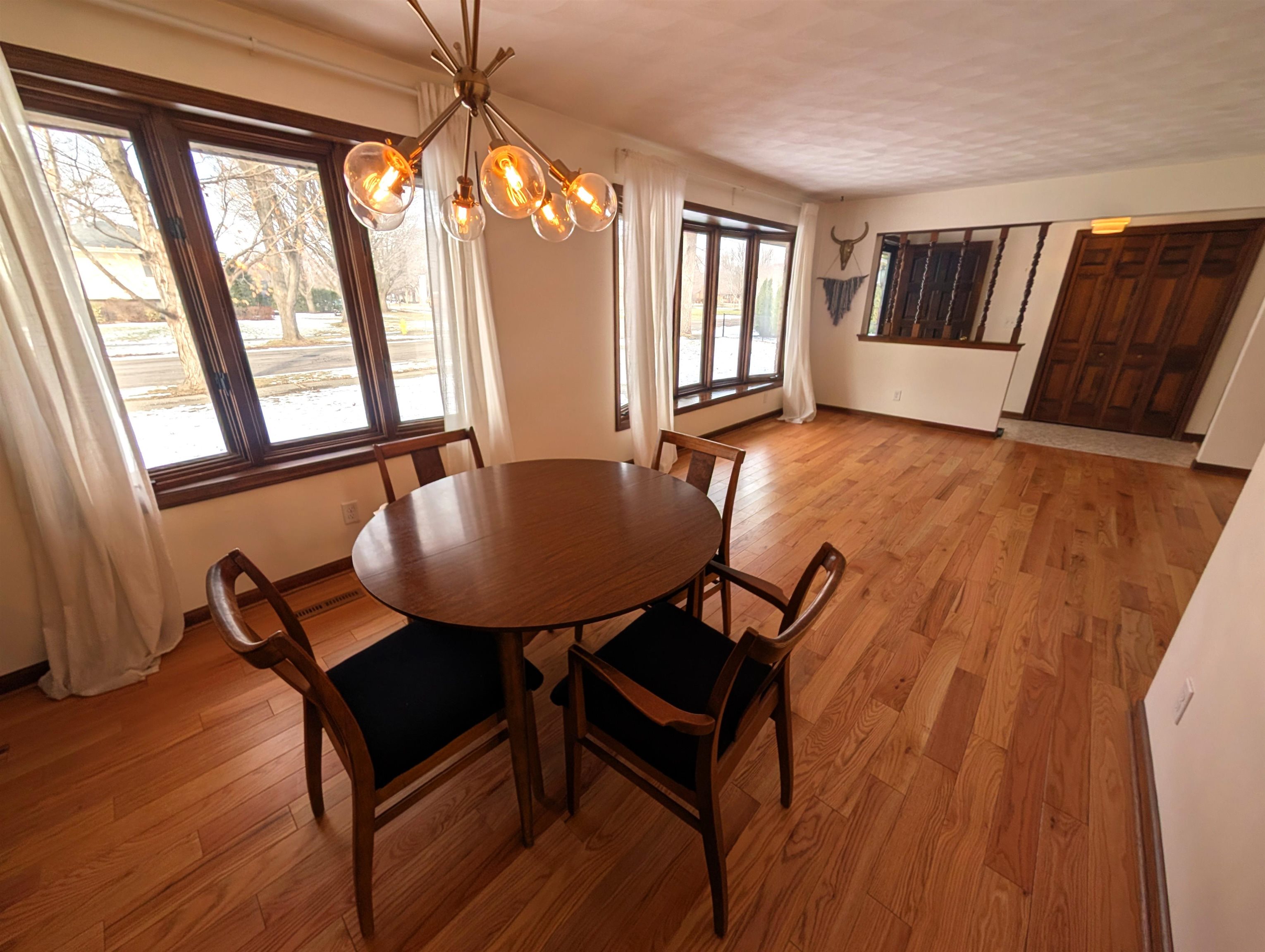 5293 Arbutus Road Rockford, IL 61107 - Photo 4 of 18 a view of a dining room with furniture and wooden floor