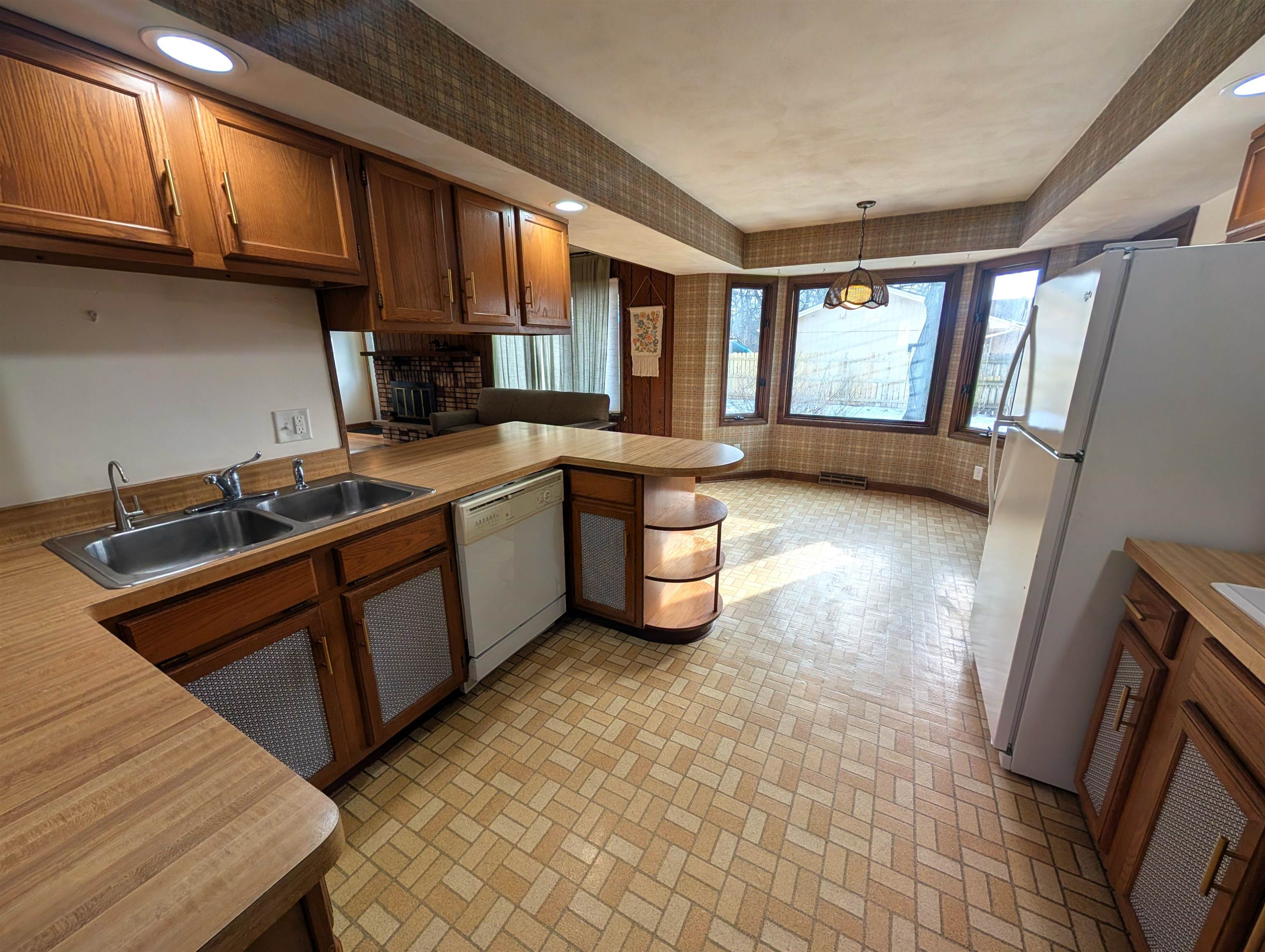 5293 Arbutus Road Rockford, IL 61107 - Photo 5 of 18 a kitchen with stainless steel appliances granite countertop a sink stove and cabinets