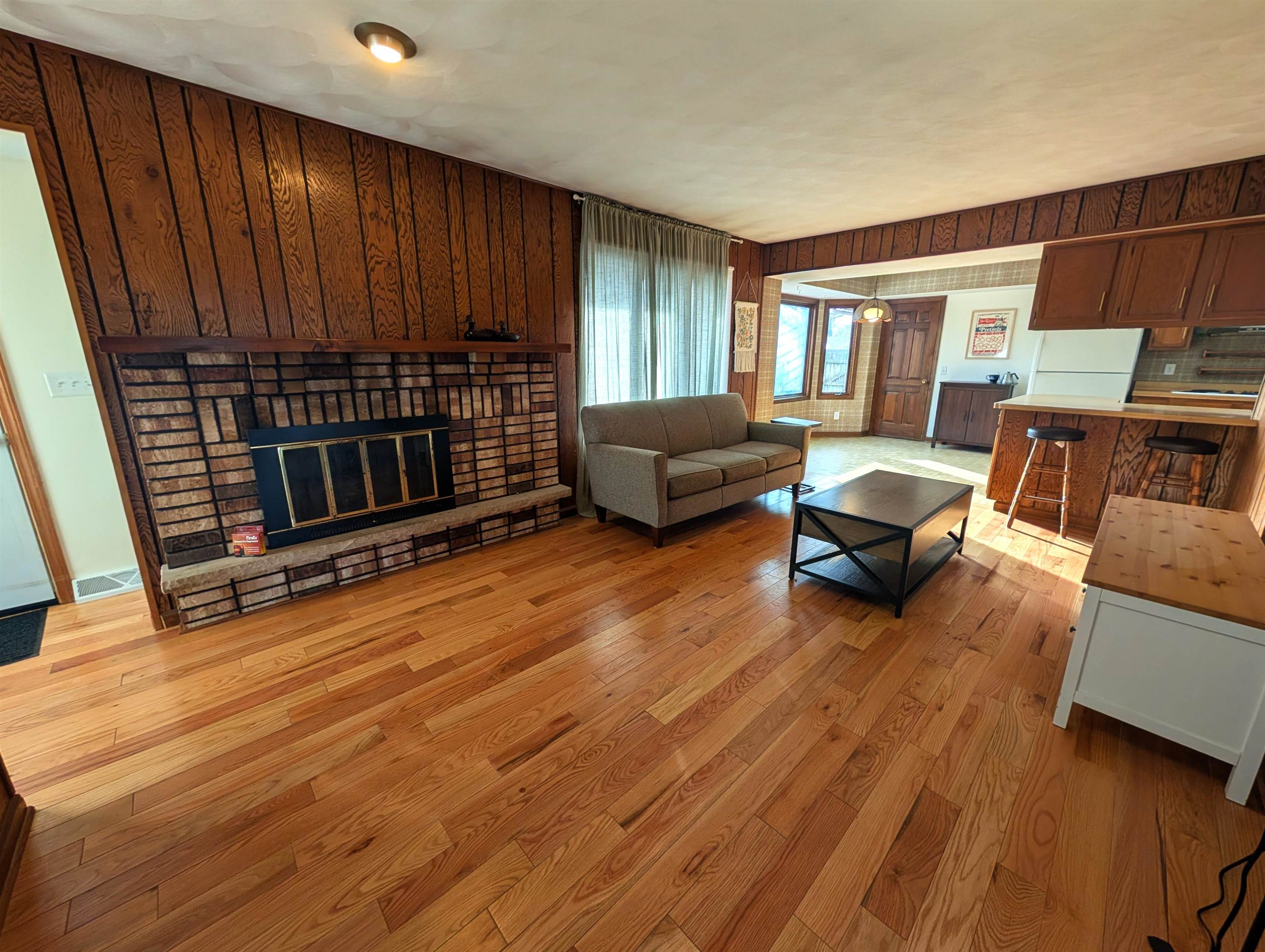 5293 Arbutus Road Rockford, IL 61107 - Photo 7 of 18 a living room with furniture and a wooden floor