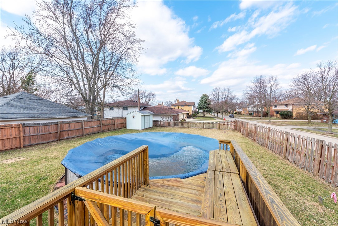 7094 Brandywine Road Parma Heights, OH 44130 - Photo 14 of 49 View of swimming pool with a storage shed and a lawn