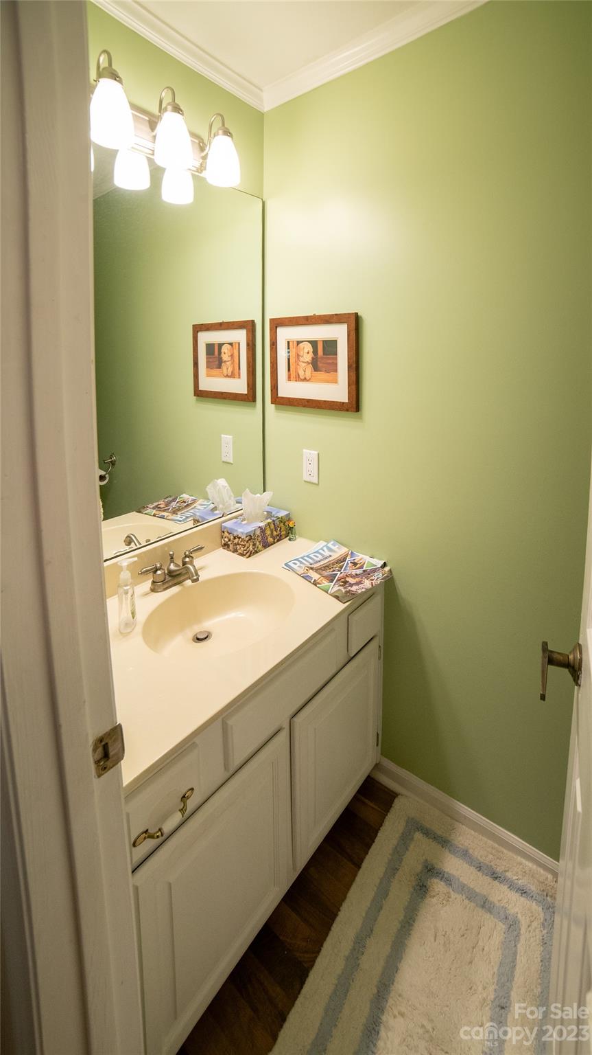 309 Victory Trail Morganton, NC 28655 - Photo 11 of 24 a bathroom with a sink and a mirror
