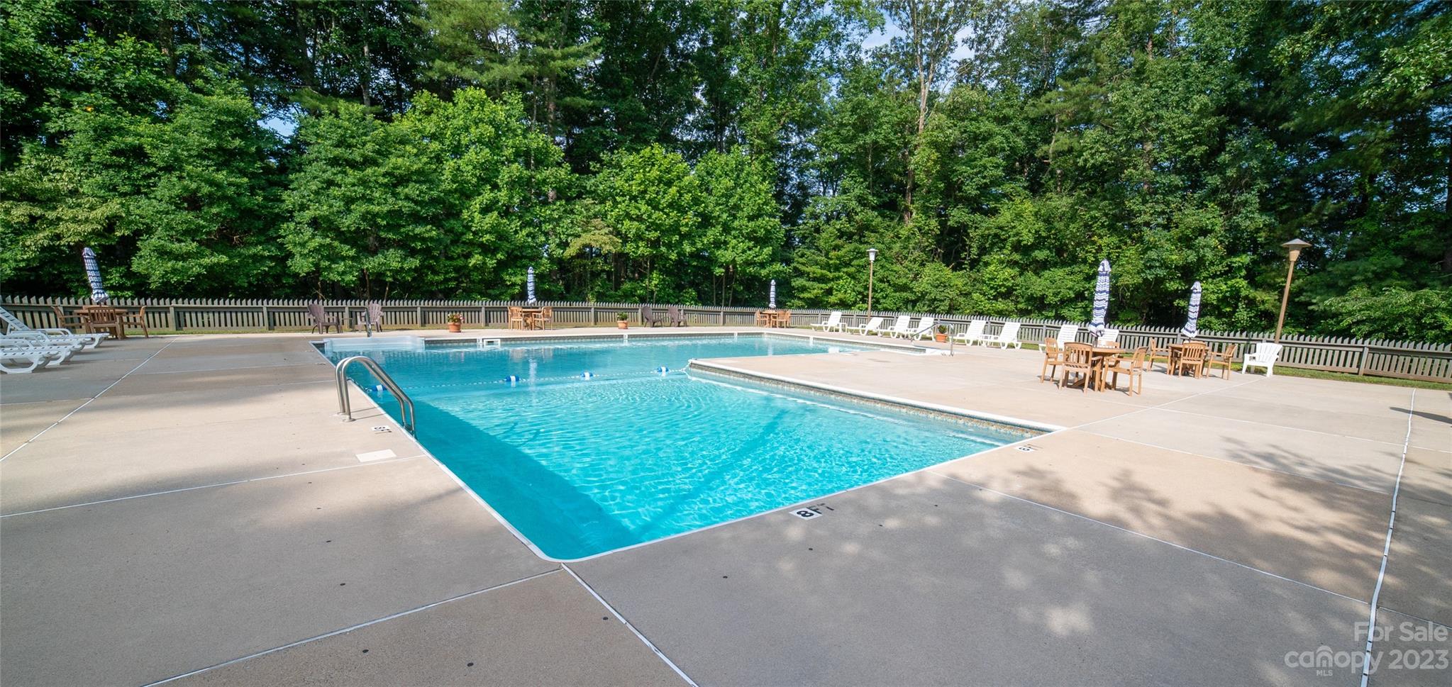 309 Victory Trail Morganton, NC 28655 - Photo 17 of 24 a view of a swimming pool with a lounge chair