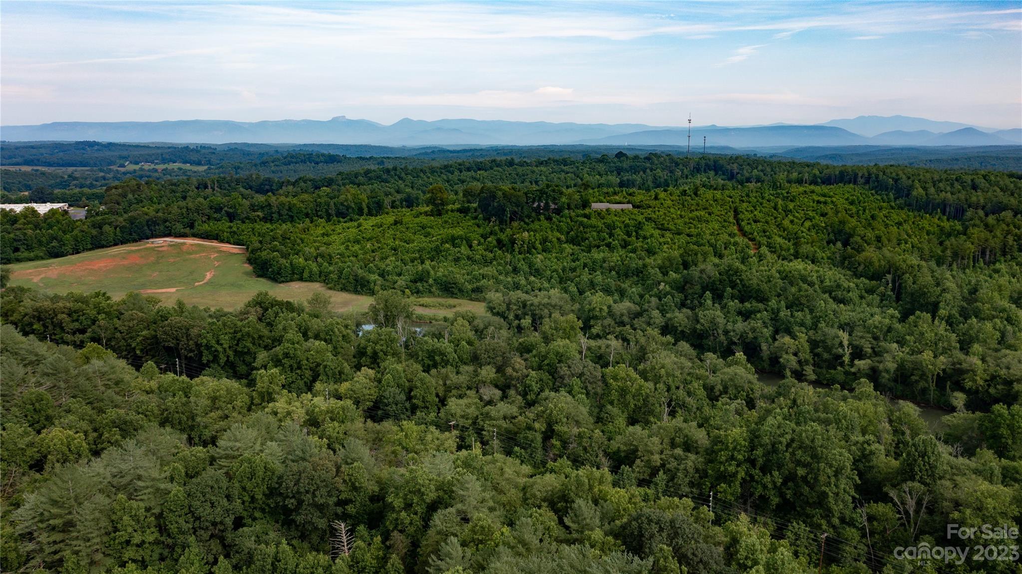 309 Victory Trail Morganton, NC 28655 - Photo 21 of 24 a view of a city with lush green forest