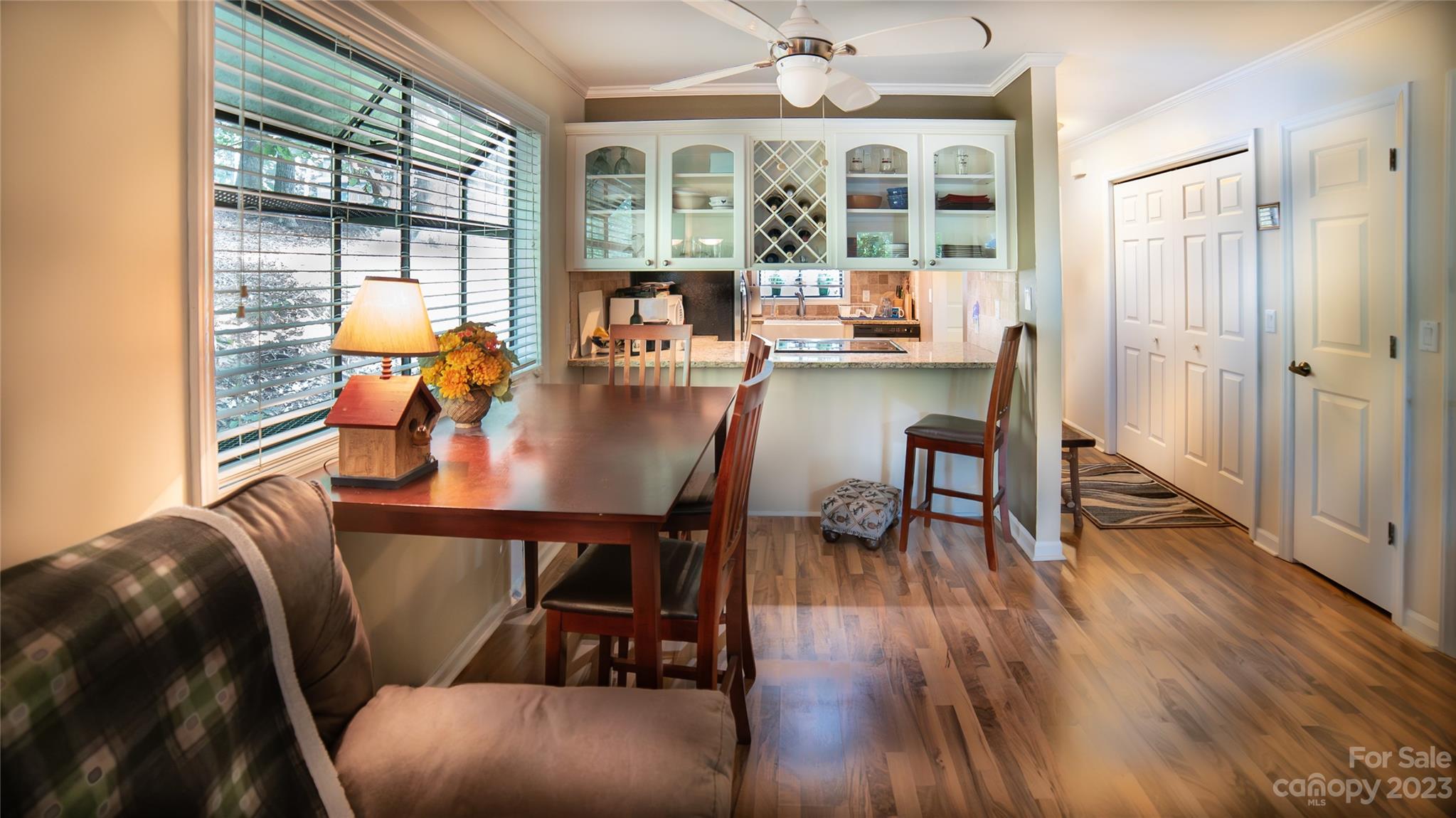 309 Victory Trail Morganton, NC 28655 - Photo 4 of 24 a view of a dining room with furniture window and wooden floor
