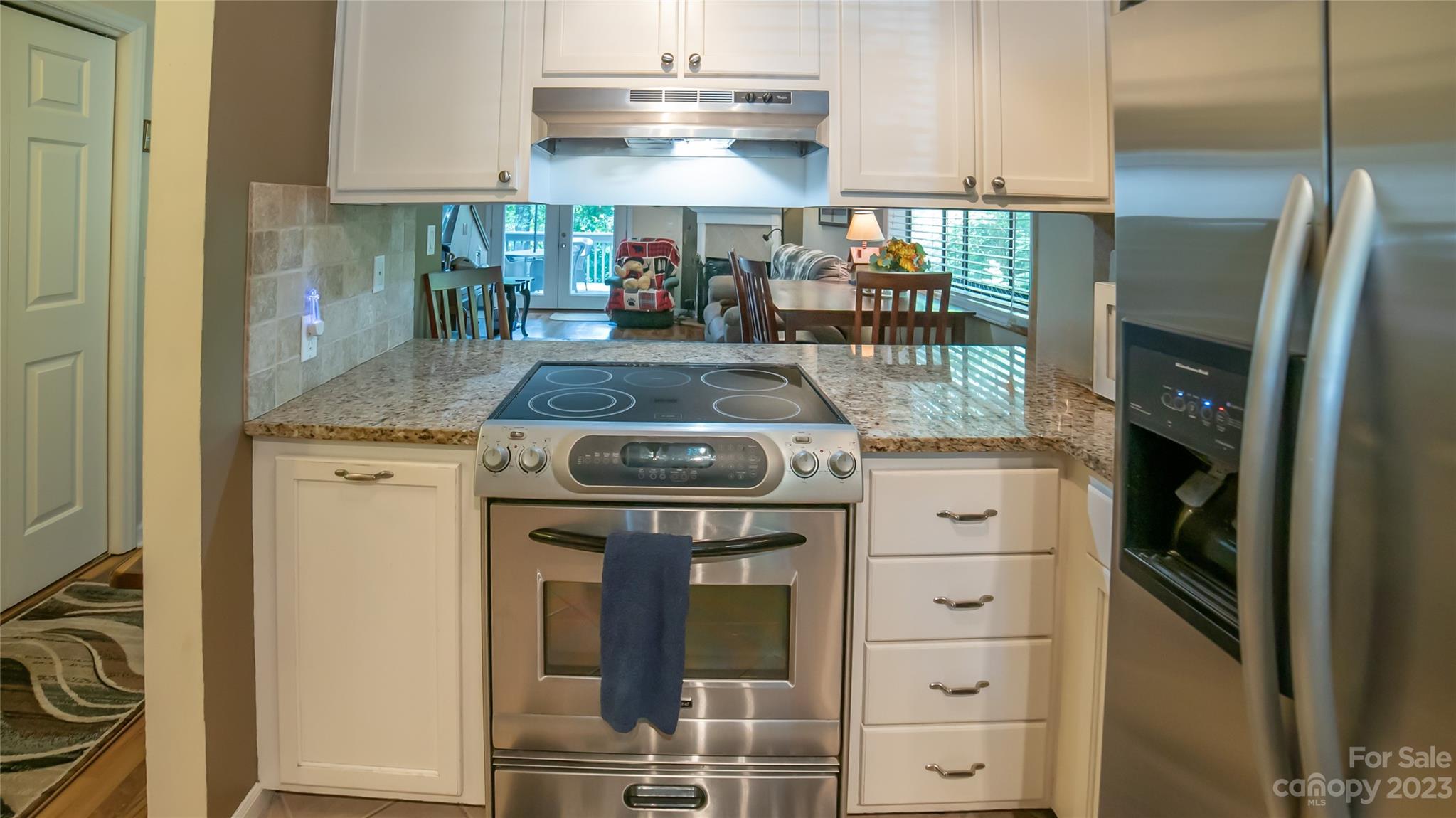 309 Victory Trail Morganton, NC 28655 - Photo 6 of 24 a kitchen with stainless steel appliances granite countertop a stove and a refrigerator