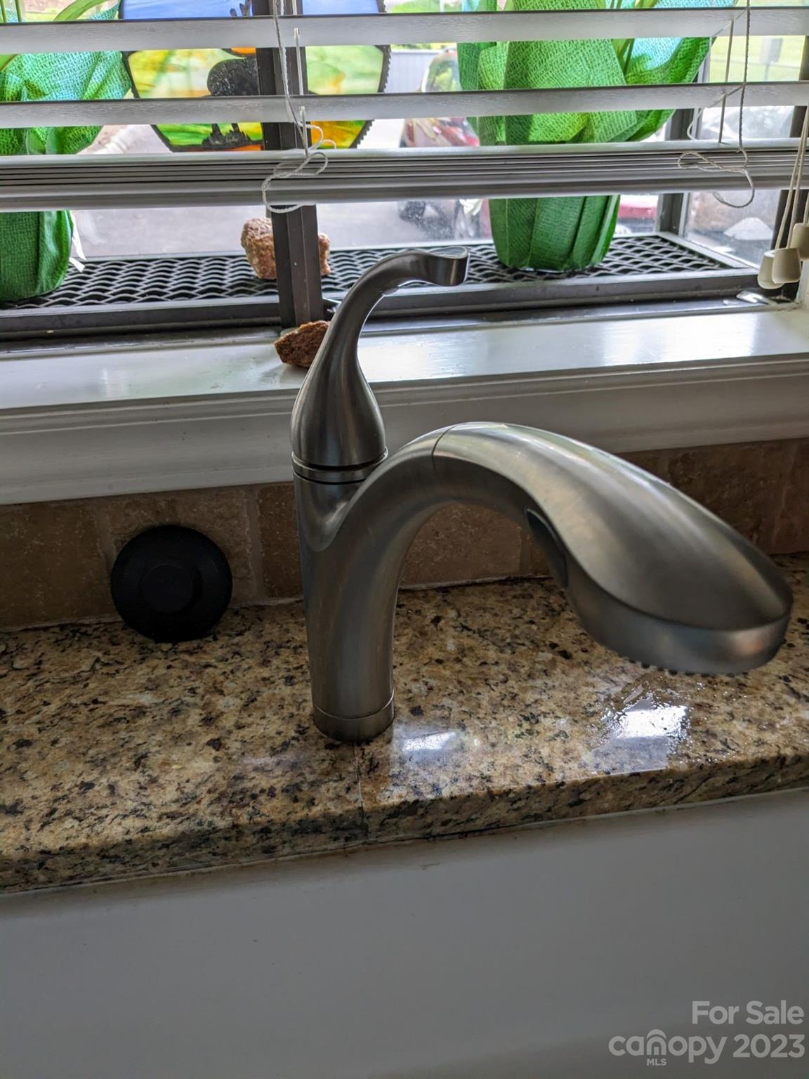 309 Victory Trail Morganton, NC 28655 - Photo 8 of 24 a bathroom with a granite countertop sink and a mirror