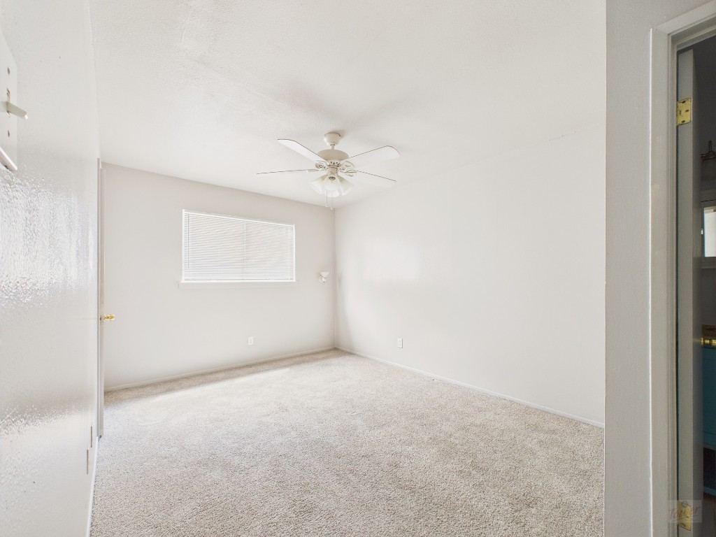 803 West 28th Street, Unit 202 Austin, TX 78705 - Photo 5 of 23 a view of an empty room with a fan