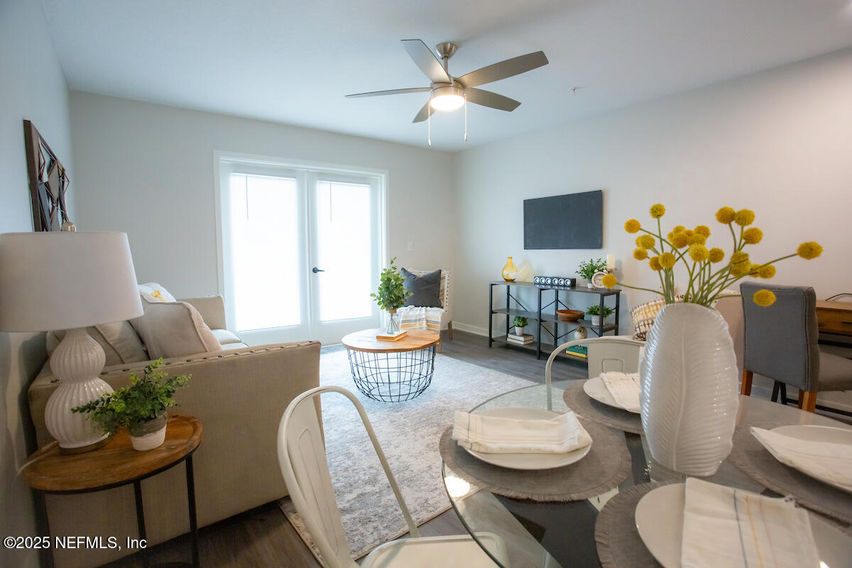 10109 Old St Augustine Road, Unit 1201 Jacksonville, FL 32257 - Photo 8 of 20 a living room with furniture and a potted plant