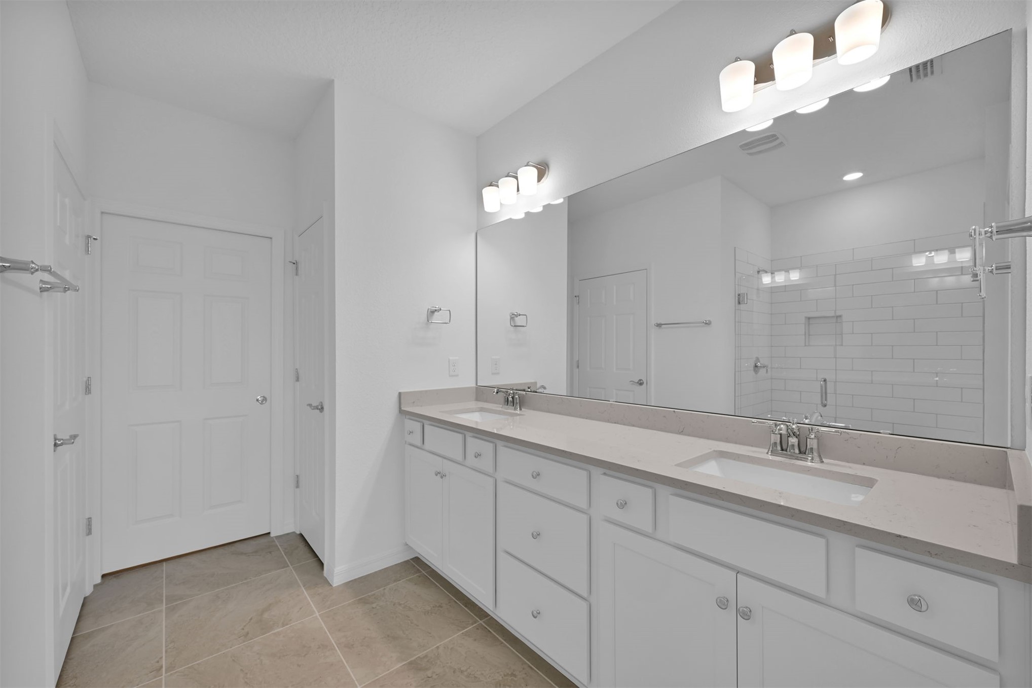 328 Ecliptic Loop Yulee, FL 32097 - Photo 18 of 41 a spacious bathroom with a granite countertop double vanity sink a mirror a lamp and bathtub