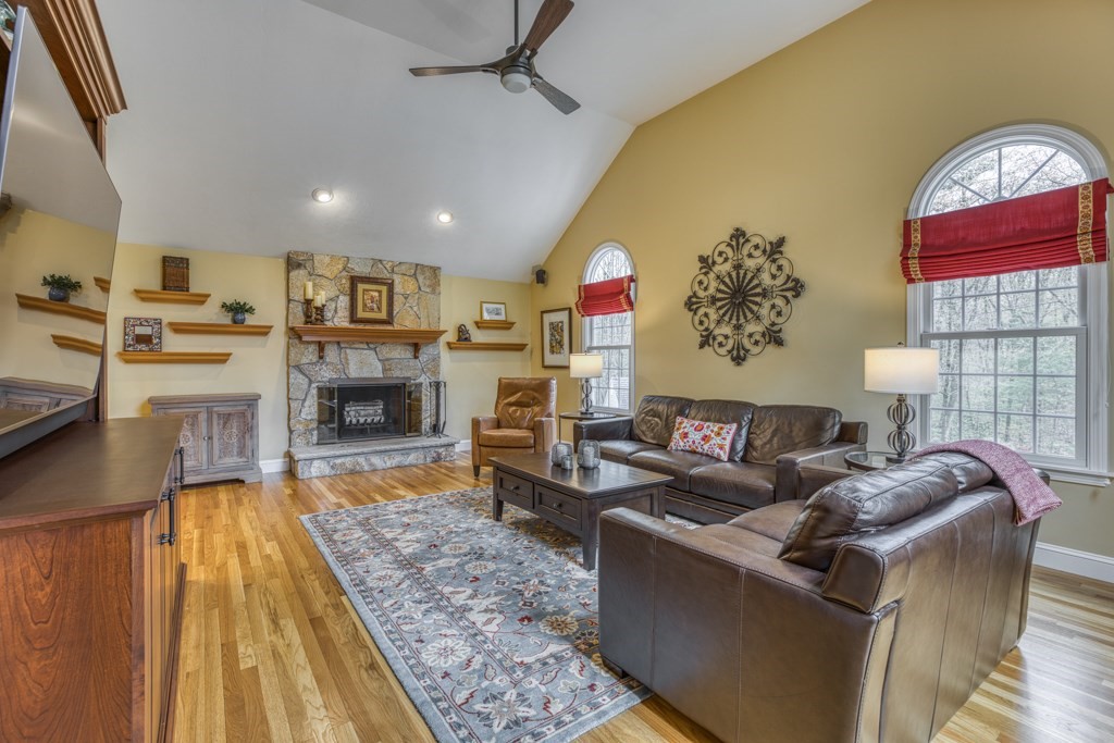 25 Baldpate Road Boxford, MA 01921 - Photo 12 of 42 a living room with furniture and a fireplace