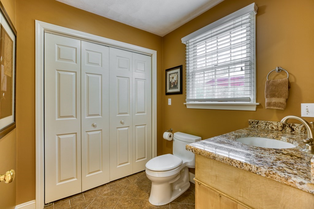 25 Baldpate Road Boxford, MA 01921 - Photo 18 of 42 a bathroom with a granite countertop sink toilet and shower