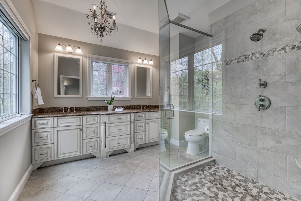 25 Baldpate Road Boxford, MA 01921 - Photo 21 of 42 a spacious bathroom with a granite countertop sink toilet and shower