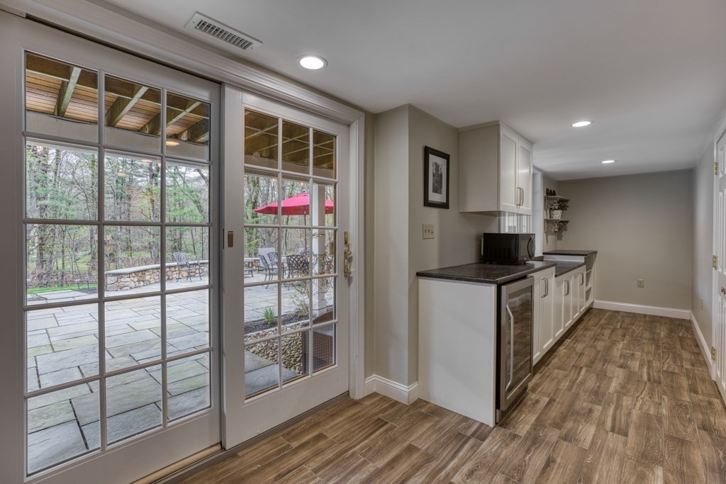 25 Baldpate Road Boxford, MA 01921 - Photo 34 of 42 a kitchen that has a lot of cabinets and wooden floor