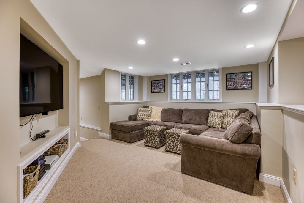 25 Baldpate Road Boxford, MA 01921 - Photo 35 of 42 a living room with furniture window and a flat screen tv