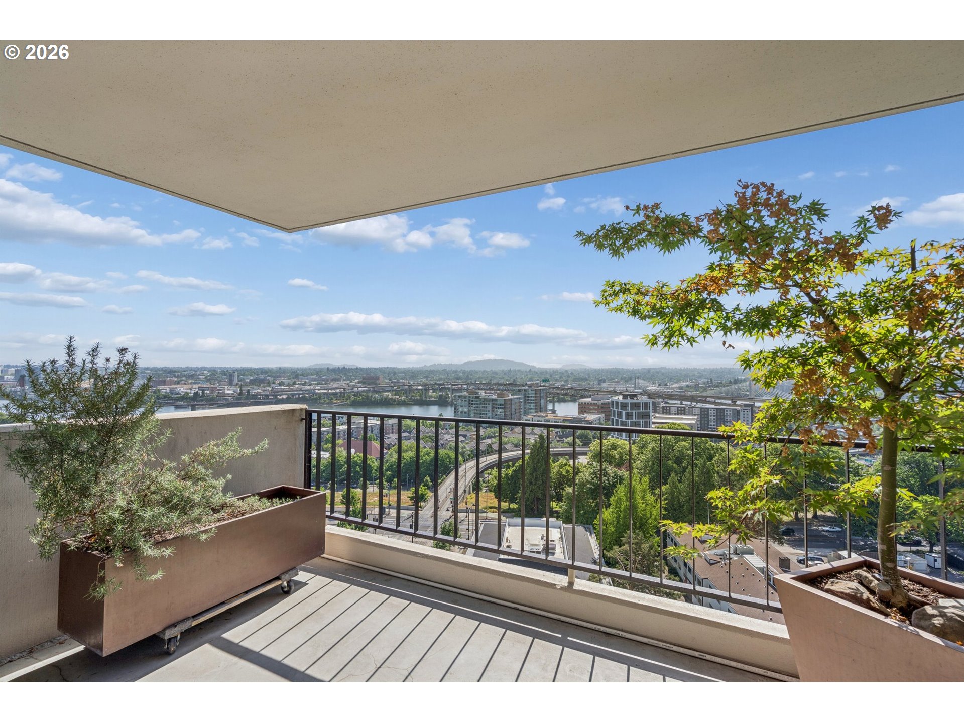 2211 Southwest 1st Avenue, Unit 1402 Portland, OR 97201 - Photo 13 of 48 a view of a balcony with wooden floor and outdoor space