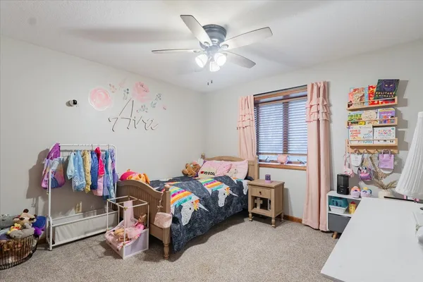 a bed room with a bed and a window