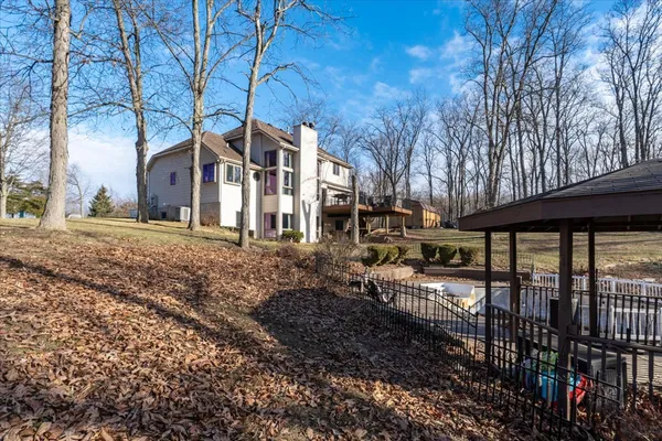 a backyard of a house with trees and houses