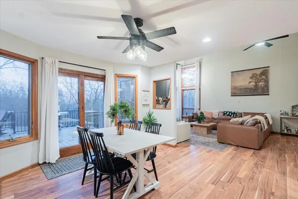 a view of a dining room with furniture window and wooden floor