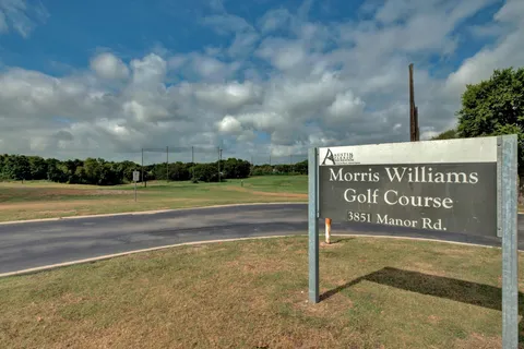 a view of sign board with ocean view
