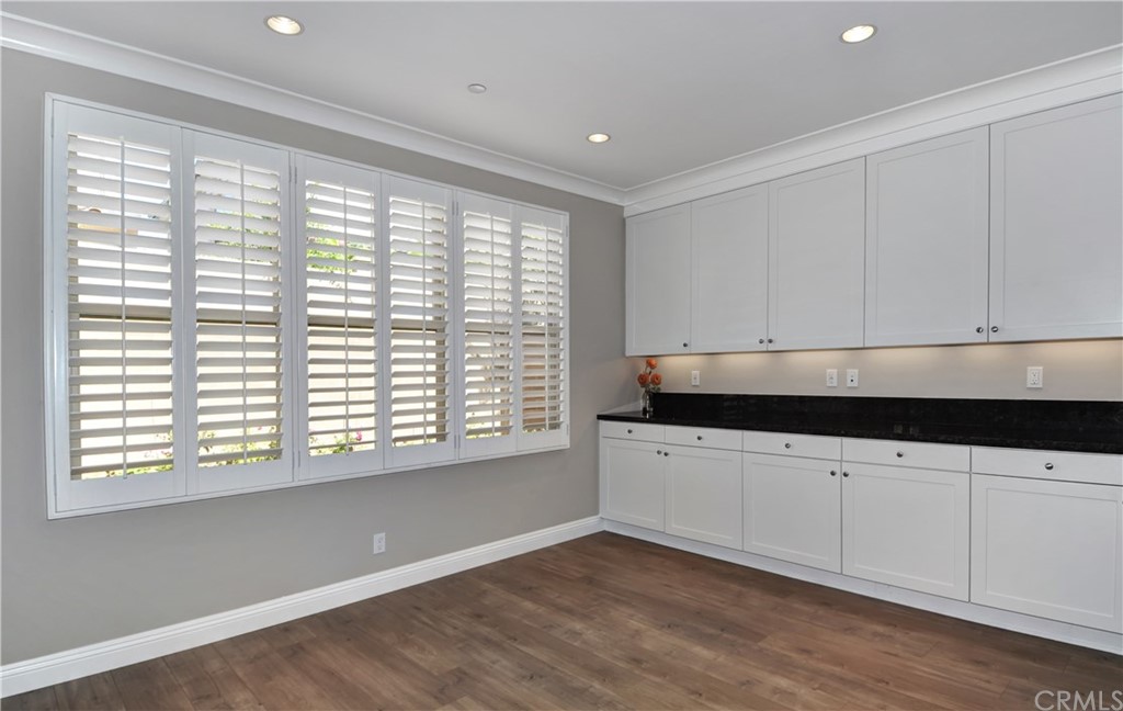 58 Ashdale Irvine, CA 92620 - Photo 5 of 18 a kitchen with granite countertop white cabinets and a window