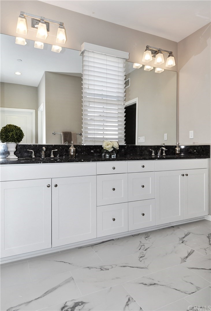 58 Ashdale Irvine, CA 92620 - Photo 10 of 18 a bathroom with a sink and a mirror