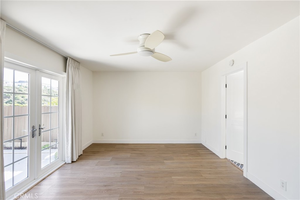 1024 Noria Street Laguna Beach, CA 92651 - Photo 14 of 53 a view of empty room with wooden floor and fan