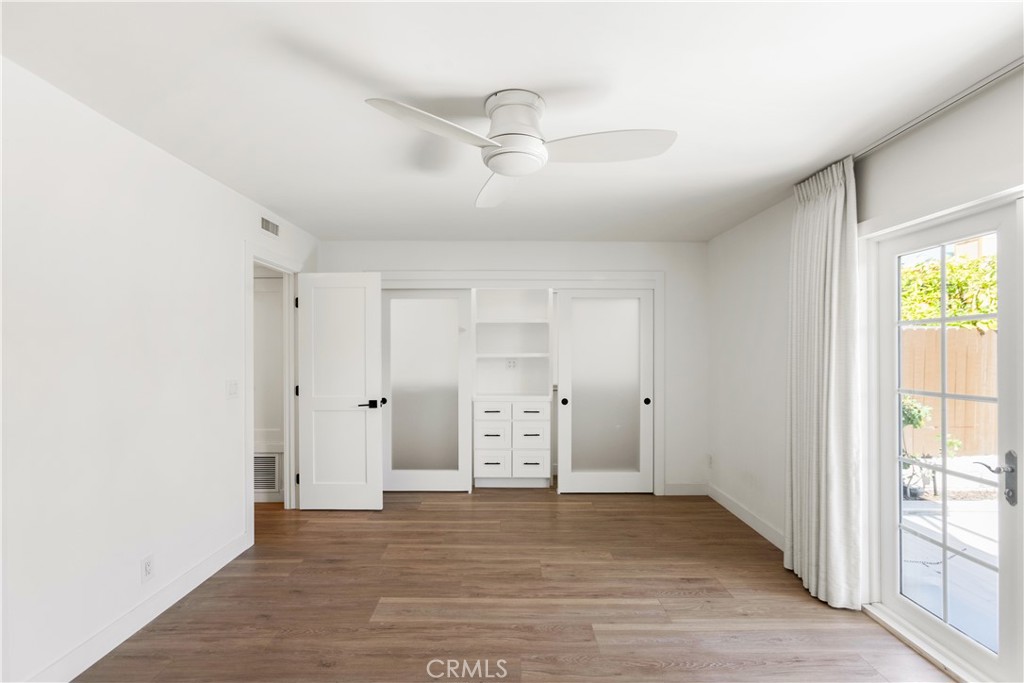 1024 Noria Street Laguna Beach, CA 92651 - Photo 15 of 53 a view of an empty room with window and wooden floor