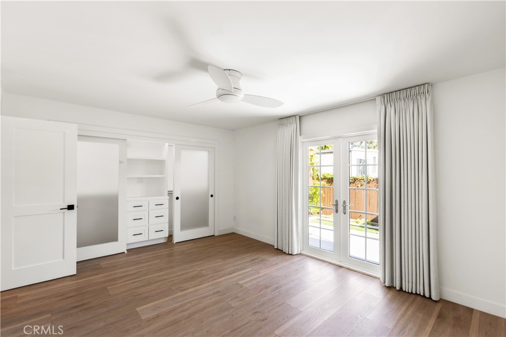 1024 Noria Street Laguna Beach, CA 92651 - Photo 16 of 53 an empty room with wooden floor and window