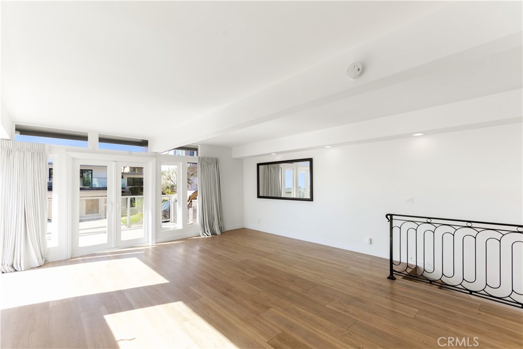 1024 Noria Street Laguna Beach, CA 92651 - Photo 18 of 53 a view of a big room with wooden floor and windows