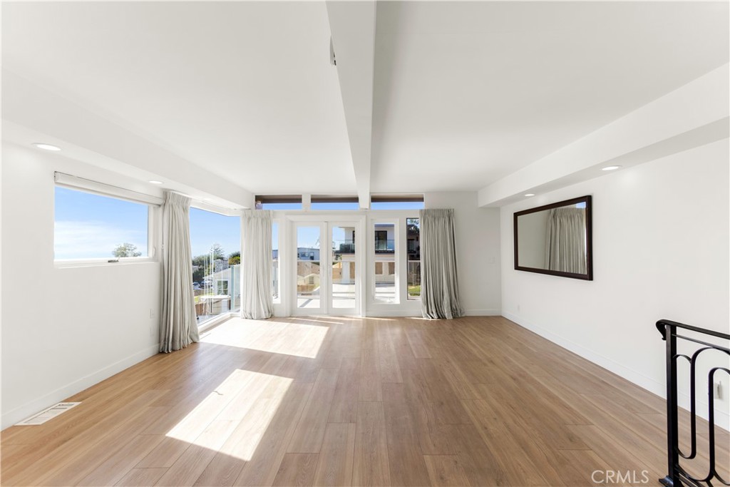 1024 Noria Street Laguna Beach, CA 92651 - Photo 19 of 53 a big room with wooden floor and windows