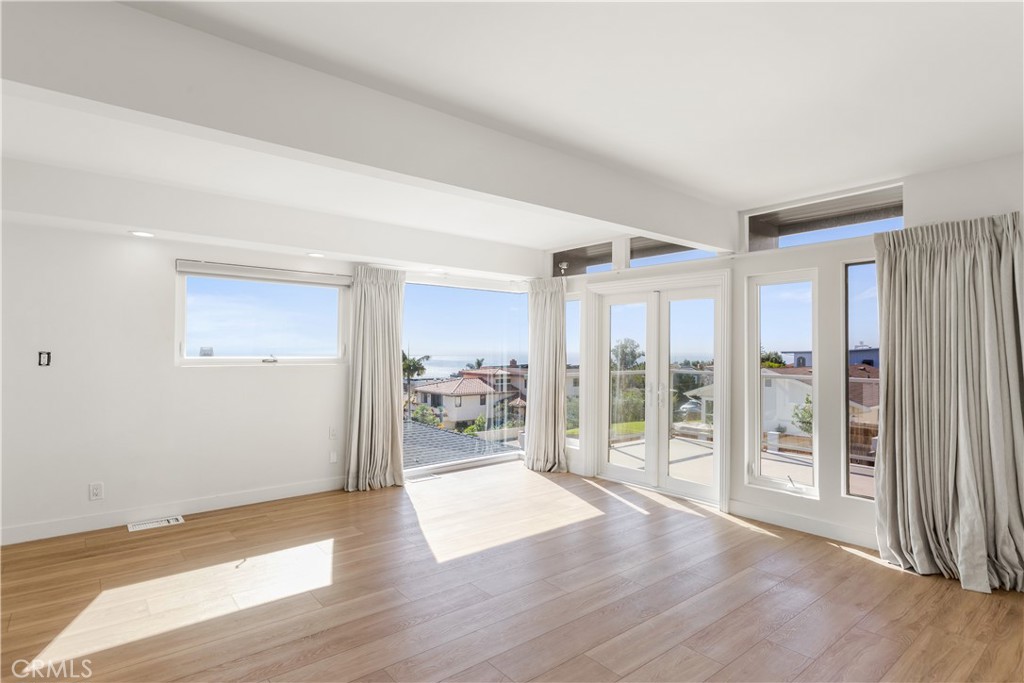 1024 Noria Street Laguna Beach, CA 92651 - Photo 20 of 53 a view of a big room with wooden floor and windows