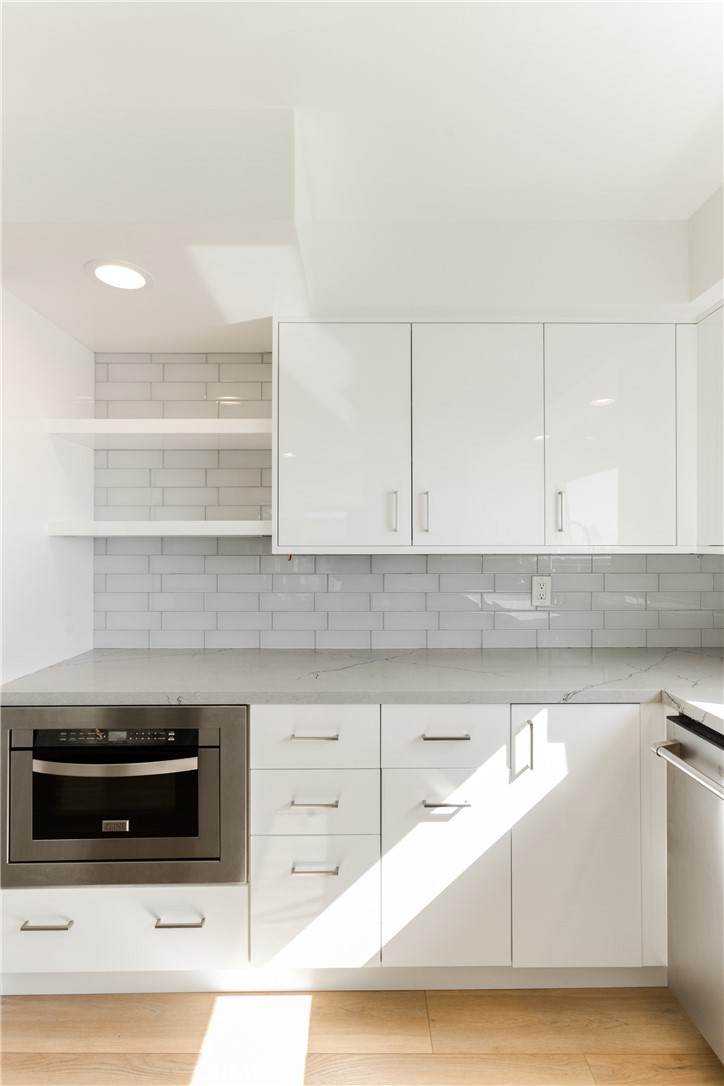 1024 Noria Street Laguna Beach, CA 92651 - Photo 32 of 53 a kitchen with granite countertop a stove and a sink