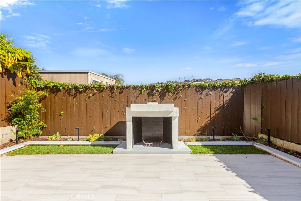 1024 Noria Street Laguna Beach, CA 92651 - Photo 34 of 53 a view of a house with a yard and a large tree