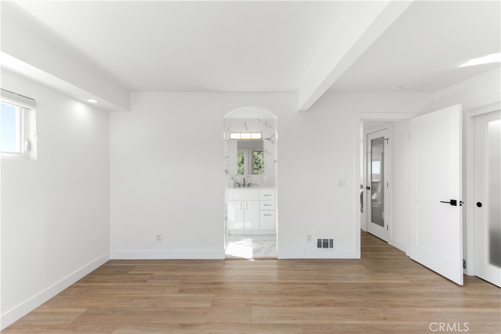 1024 Noria Street Laguna Beach, CA 92651 - Photo 41 of 53 a view of an empty room with wooden floor and a window