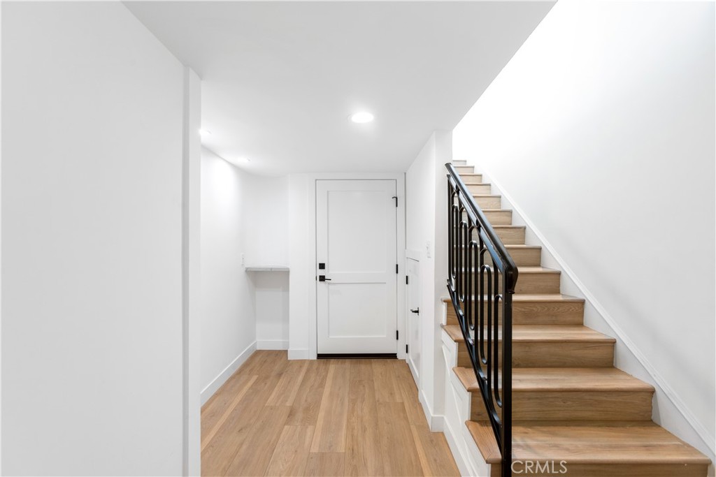1024 Noria Street Laguna Beach, CA 92651 - Photo 5 of 53 a view of a hallway with wooden floor and entryway