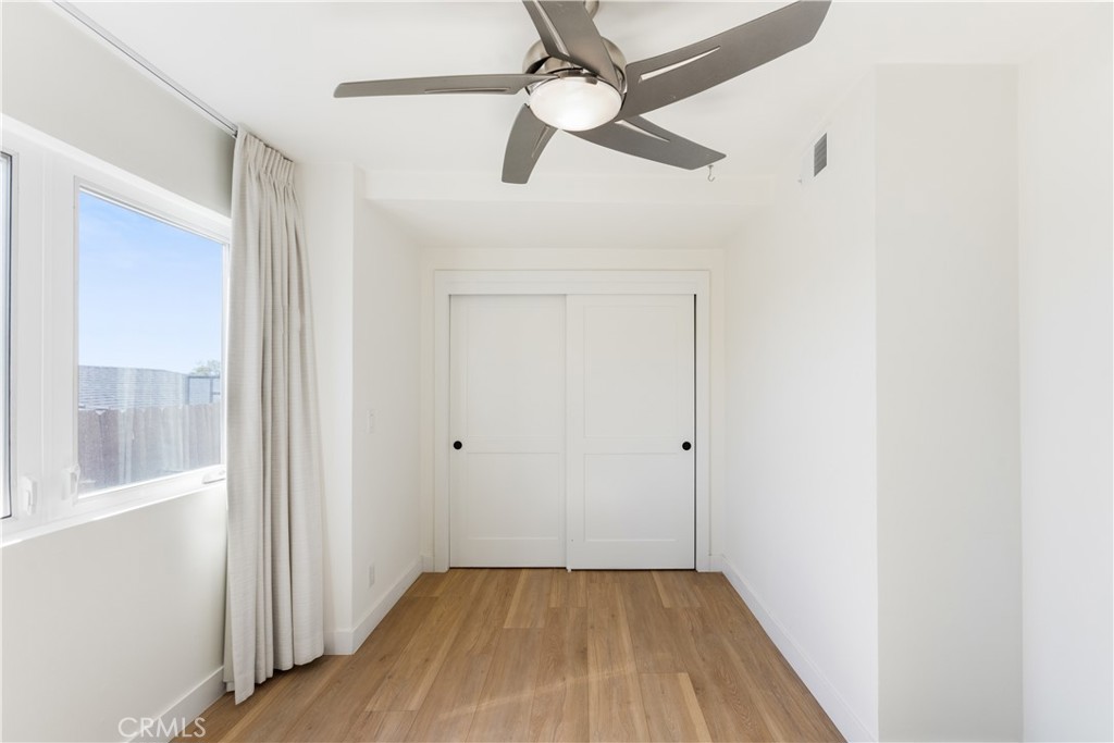 1024 Noria Street Laguna Beach, CA 92651 - Photo 7 of 53 a view of empty room with wooden floor and fan