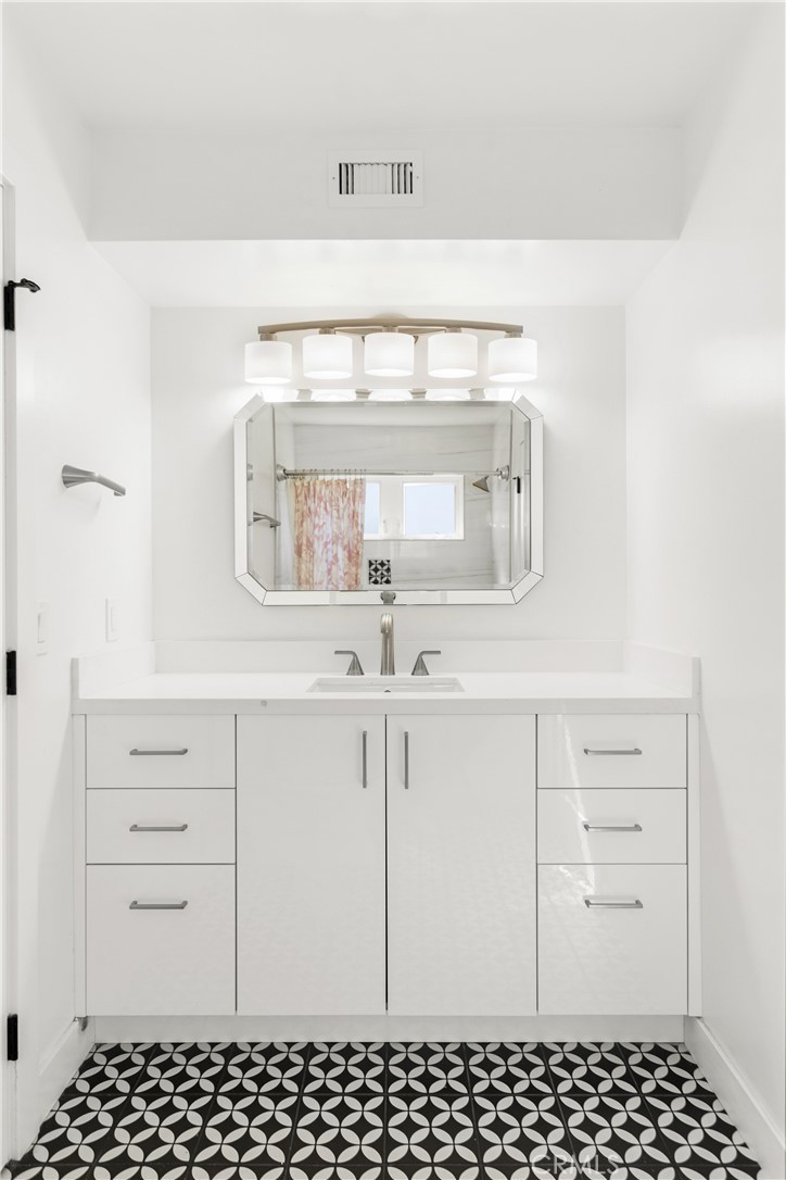 1024 Noria Street Laguna Beach, CA 92651 - Photo 10 of 53 a bathroom with a sink and a mirror