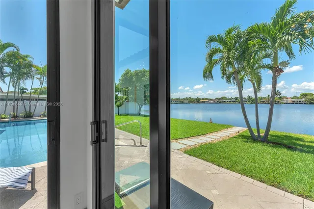 a kitchen with a sink and a refrigerator