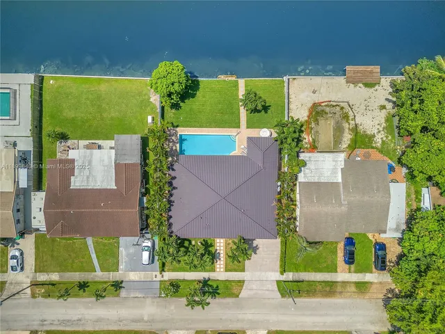 a view of house with a swimming pool