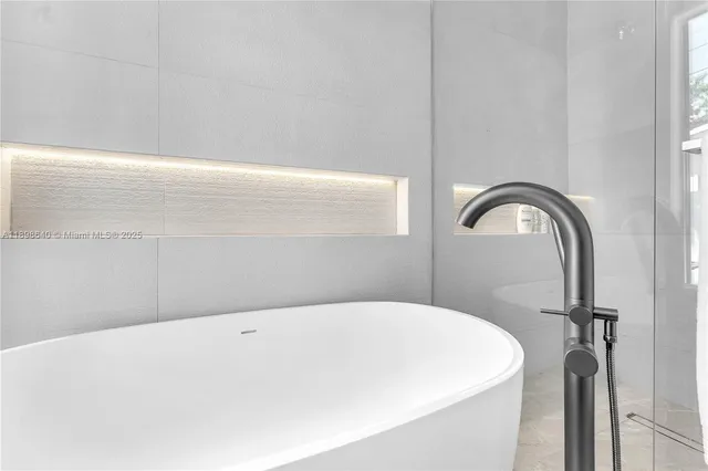 a view of a room with wooden floor and windows