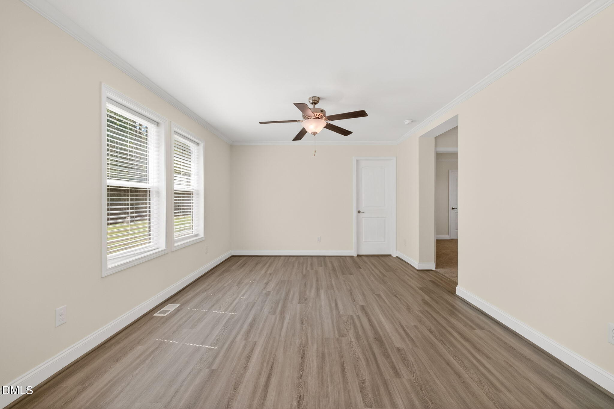 7122 Guess Road Hillsborough, NC 27278 - Photo 33 of 48 a view of an empty room with wooden floor and a window