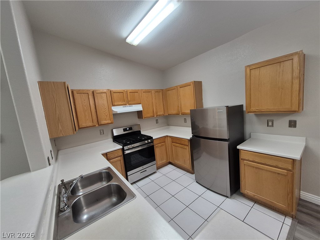 2053 Quarry Ridge Street, Unit 201 Las Vegas, NV 89117 - Photo 16 of 21 A well-appointed kitchen showcasing durable countertops and quality appliances.