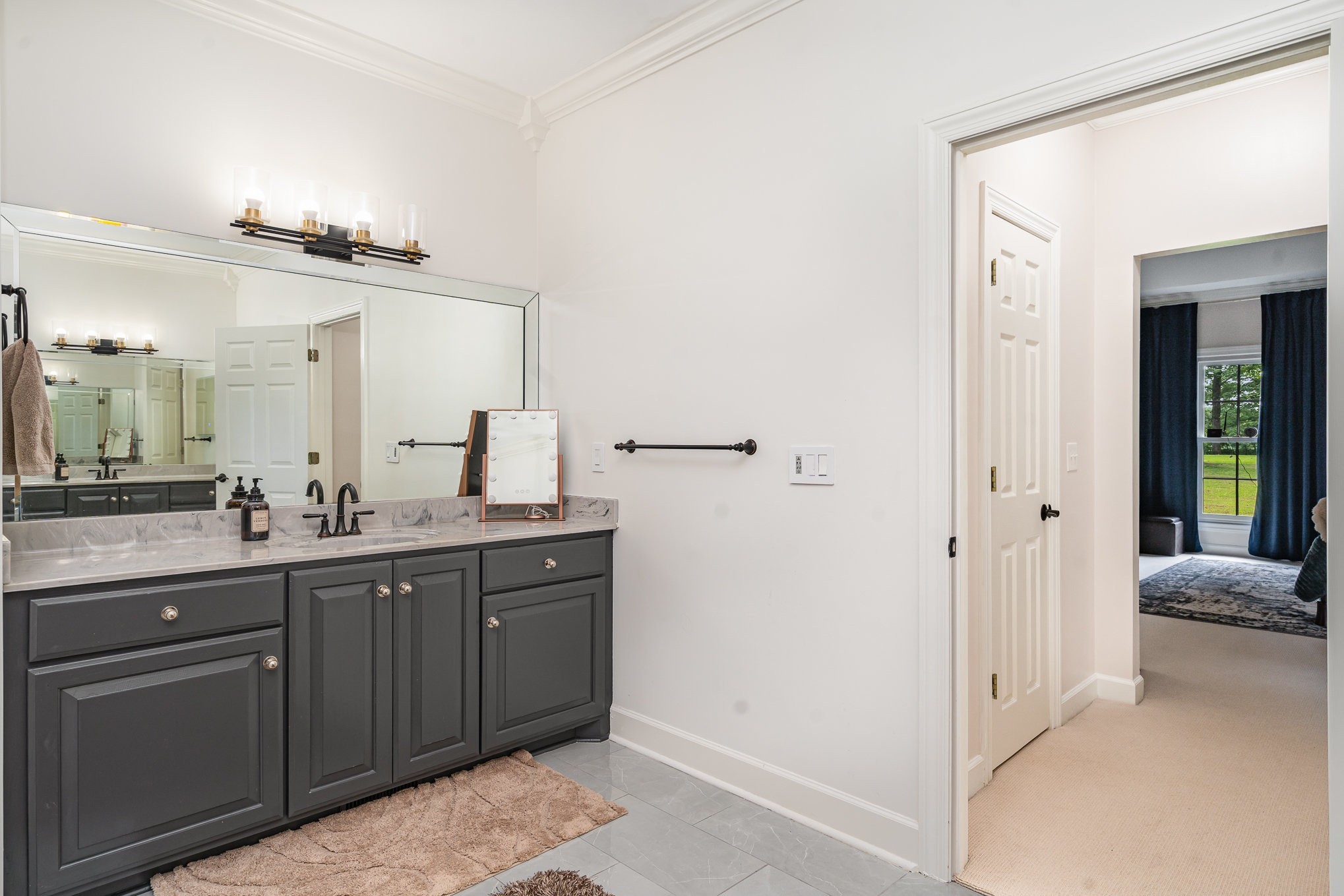 1640 Eno Road Dickson, TN 37055 - Photo 25 of 64 a bathroom with a double vanity sink and mirror