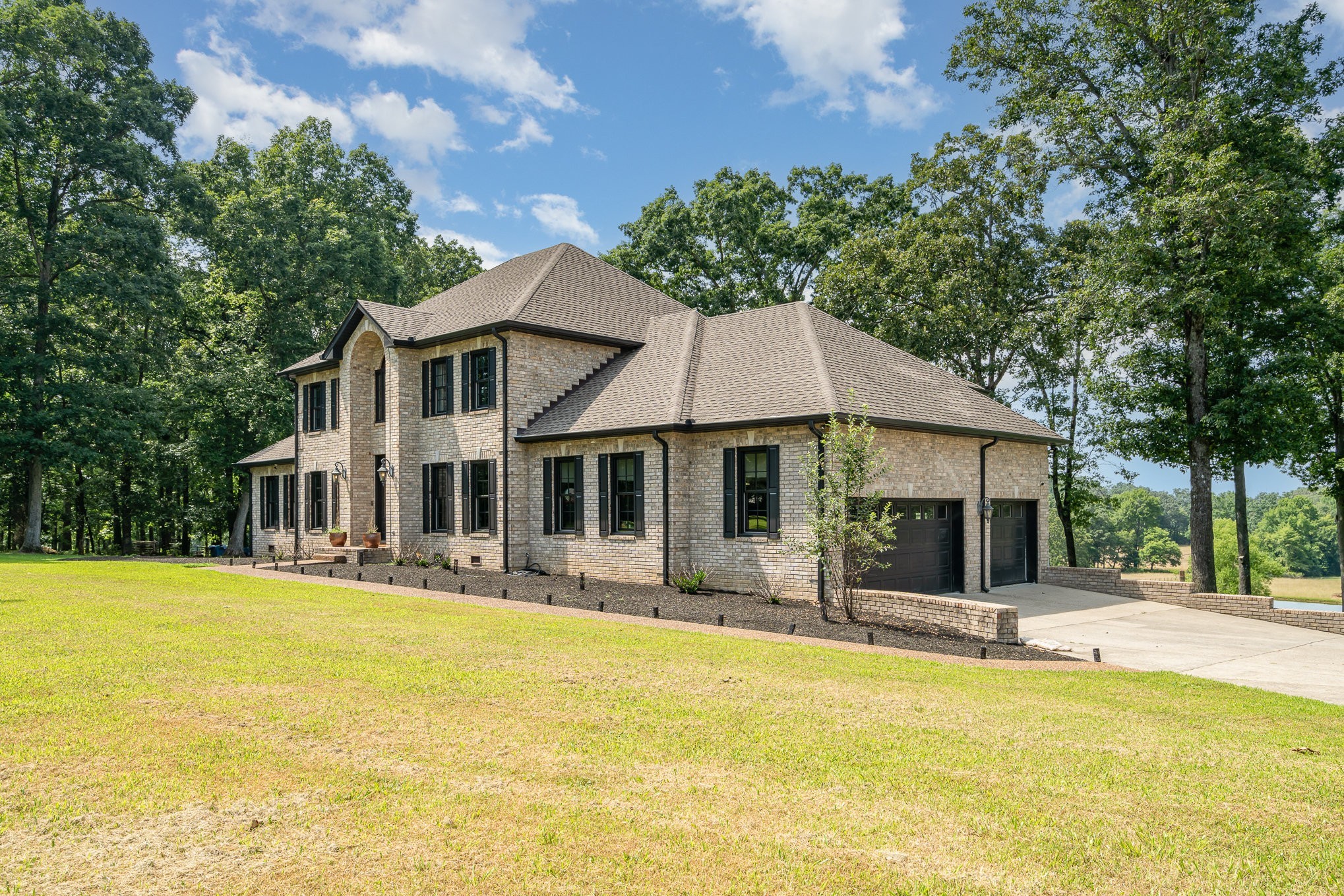 1640 Eno Road Dickson, TN 37055 - Photo 10 of 64 a front view of a house with swimming pool and porch